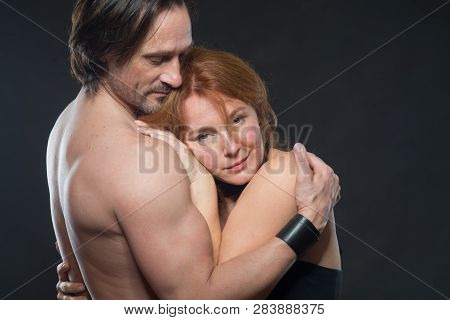 Comfort And Harmony. Portrait Of Lovely Pleased Woman Keeping Her Head At Her Husbands Bare Chest Wh
