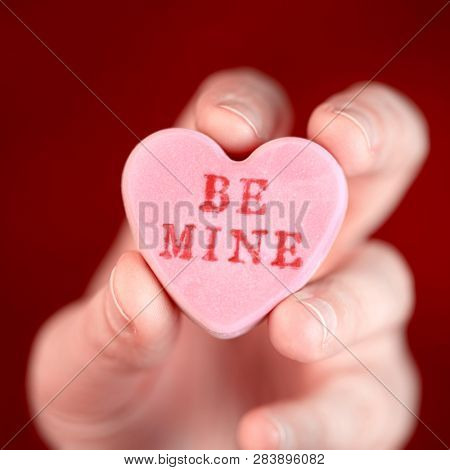 Hand holding converstation heart - Be Mine