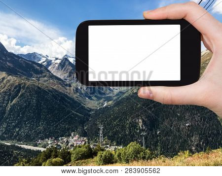 Travel Concept - Tourist Photographs Of Dombay Resort Village Between Mountains In Teberda Nature Re