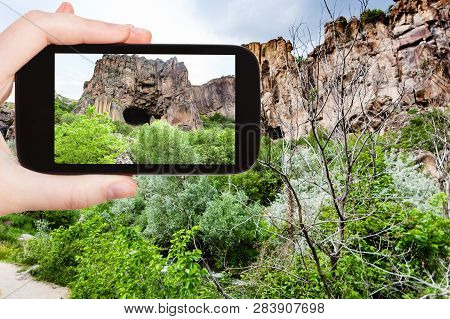 Travel Concept - Tourist Photographs Of Mountain Cave In Ihlara Valley Of Aksaray Province In Cappad