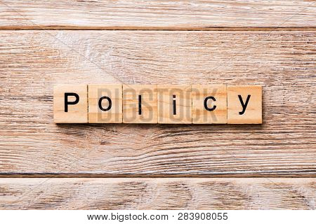Policy Word Written On Wood Block. Policy Text On Wooden Table For Your Desing, Concept
