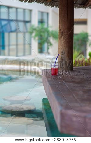 Refreshing Cocktail By The Pool On The Open-air Barn Store