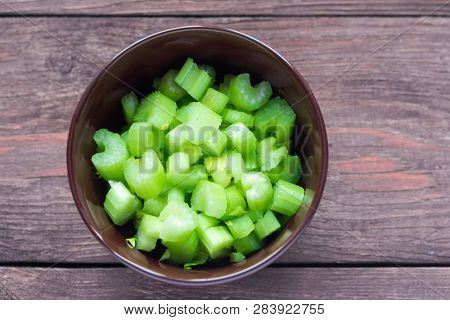 Fresh Celery Sliced For Salad, On Wooden Background