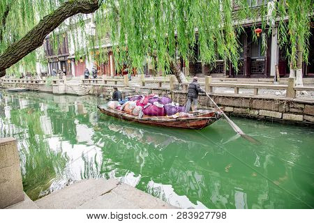 Zhouzhuang,jiangsu,china - December 14 2018 : Unknown People On A Pick-up Boat For The Dry-cleaners 