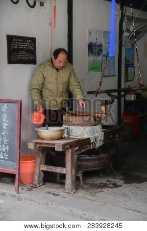 Zhouzhuang,jiangsu,china - December 14 2018 :an Unknown Person, Artisan Who Makes Fresh Tofu In Zhou