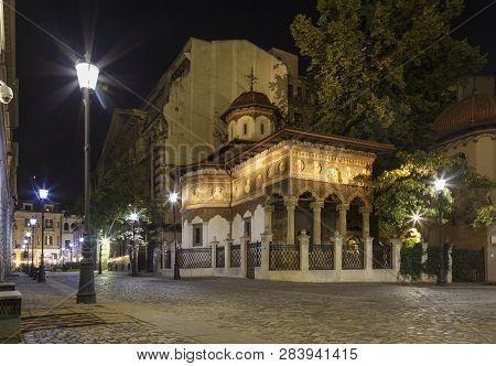 Bucharest Old City Centre Panorama View. Stavropoleos Church By Night. Old Town Tourist Attraction I