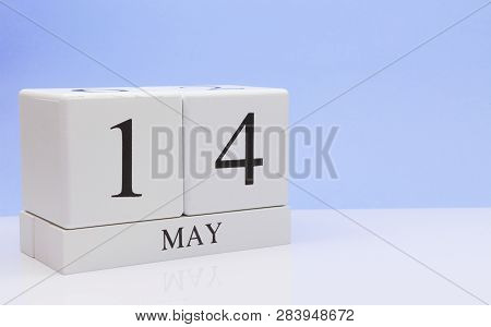 May 14st. Day 14 Of Month, Daily Calendar On White Table With Reflection, With Light Blue Background