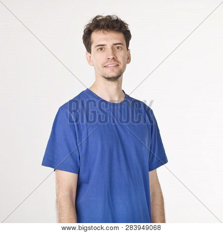 Attractive Smiling Boy In Blue T-shirt Isolated