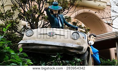 Osaka, Japan - Feb 11 2019 : Lupin The 3rd Car Chase Xr Ride At The Entrance Of Lupin And  Jigen Fig