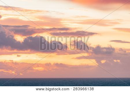 Red Orange Sky After Sunset Over Sea Water Surface