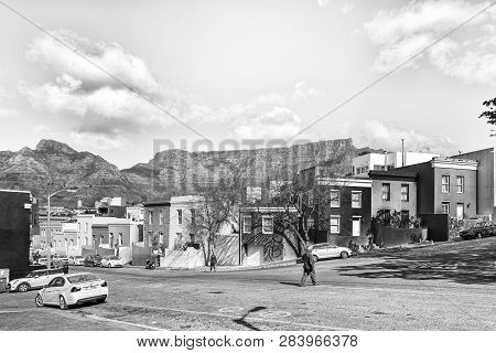 Cape Town, South Africa, August 17, 2018: A Street Scene, With Historic Houses, People And Vehicles,