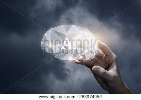 A Closeup Of A Male Hand Holding A Brain Model With Abbreviation Inside At The Blurred Background. T