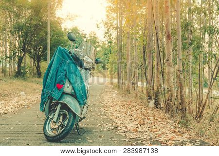 Red Heart In Pocket Of Denim Blue Jean Shirt On A Motorcycle.