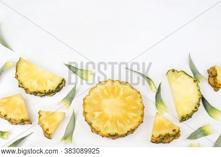 Sliced Pineapple With Green Pineapple Leaves Isolated On White Background With Copy Space For Your T
