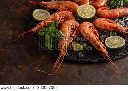 Fresh King Shrimps, Prawns In A Black Slate Board On Rusty Background