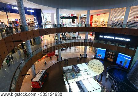 Dubai, Uae - November 22, 2017: Shoppers Visit Dubai Mall. It Is The Largest Mall In The World By To