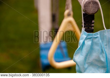 Close-up Photo Of A Protective Medical Mask On The Background In The Park. Refusal To Wear Protectiv