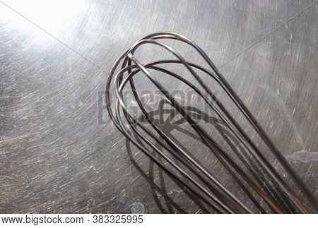 Manual Hand Mixer For Blending, Beating, Egg Beater Isolated On Metal Background. Metal Stainless St
