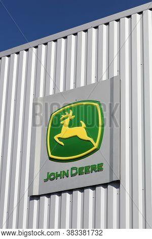 Roanne, France- July 5, 2020: John Deere Sign On A Wall. John Deere Is An American Corporation That 