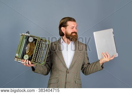 Typewriter Vs Laptop. Bearded Journalist Holds Typewriter And Laptop. Antiques, Old, Journalist, Sec