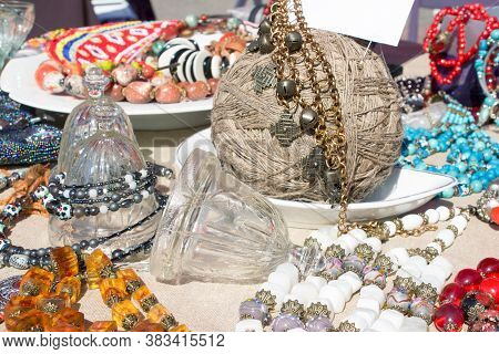 Different Antiques On Flea Market Or Festival - Collectible Glass And Crystal Bells, Vintage Amber A