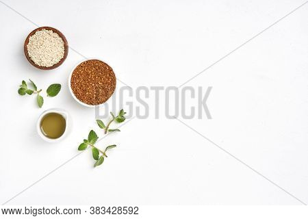 Middle Eastern Red And Green Zaatar Spices With Fresh Zaatar Leaves And Olive Oil. Top View With Cop
