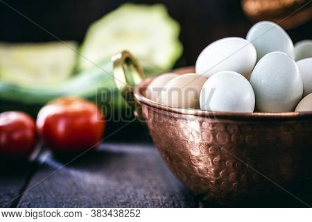 Colorful Caipira Egg Typical Of Brazil, In Copper Pot, On Rustic Wooden Background