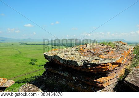 A Large And Flat Sacrificial Stone Set On The Top Of A Mountain Overlooking The Endless Steppes.