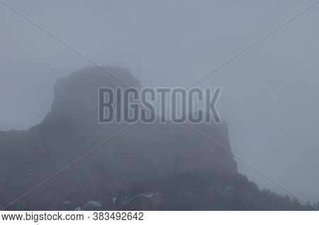 Crag in the fog. Ordesa Valley. Ordesa and Monte Perdido National Park. Pyrenees. Huesca. Aragon. Spain.