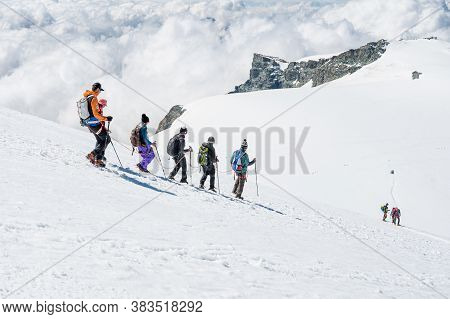Cervinia, Italy - July 18, 2020: Mountaineers Ascending And Tackling Slopes Of Breithorn - Considere