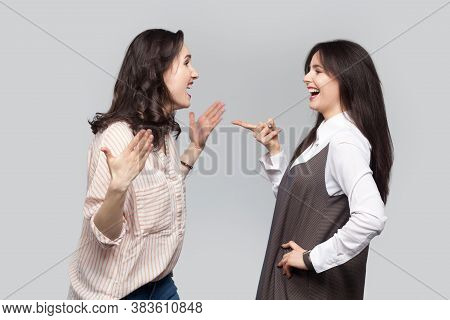 Portrait Of Happy Emotional Beautiful Best Friends In Casual Style Standing Talking, Discussing Toge