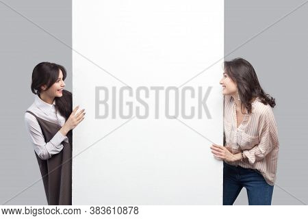 Portrait Of Happy Beautiful Brunette Young Women In Casual Style Standing Near Empty White Blank Cop