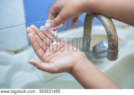 Kid Washing Hands With Alcohol Gel Or Antibacterial Soap Sanitizer, Hygiene Concept. Prevent The Spr