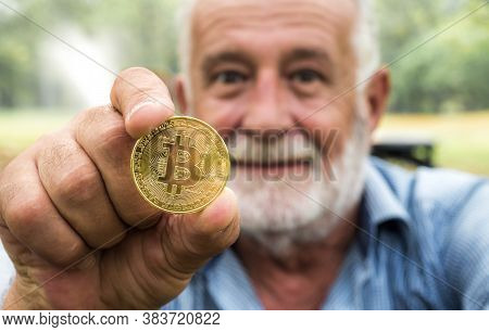 Bitcon, Man Holding Golden Coinl In Hand
