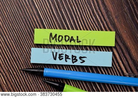 Modal Verbs Write On Sticky Notes Isolated On Office Desk.