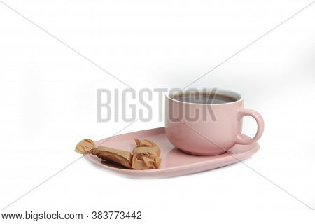 A Cup Of Tea On A Saucer And Stickjaws Isolated On White Background. Image Contains Copy Space