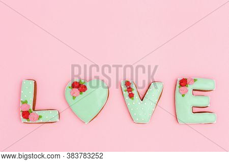 Inscription Love By Homemade Cookies On Pink Background With Copy Space. Holiday Concept For Wedding