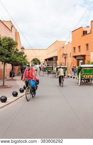 Marrakesh, Morocco - October 30, 2018: Moroccon Man Riding A Bike Near The Kasbah Of Marrakesh. The 