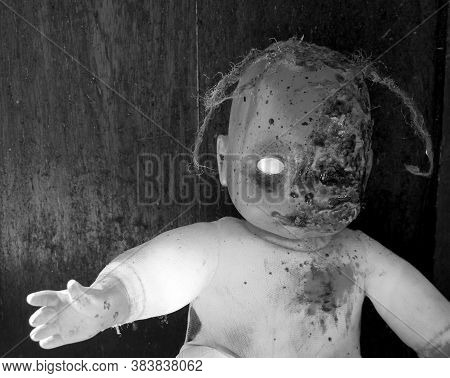 Creepy bloody doll Halloween concept, Close up of children Ghost mystic doll, Scary horror doll face