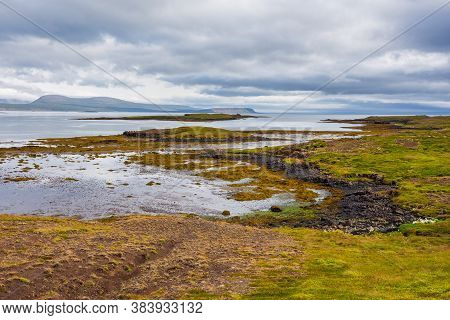 View Of The Hvammsfjordur Coast, Hills In The Background, Eastern Iceland.