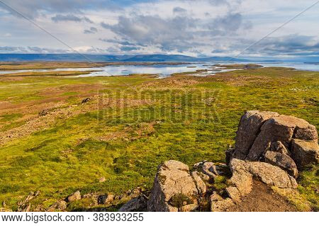 View Of The Hvammsfjordur Coast, Hills In The Background, Eastern Iceland.