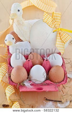 Box Of Eggs And Easter Decorations