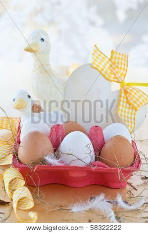 Box Of Eggs And Easter Decorations