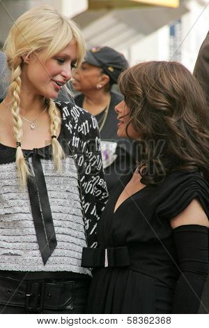 Paris Hilton and Paula Abdul at the Ceremony Honoring Los Angeles Lakers Owner Jerry Buss with the 2,323rd star on the Hollywood Walk of Fame. Hollywood Boulevard, Hollywood, CA. 10-30-06