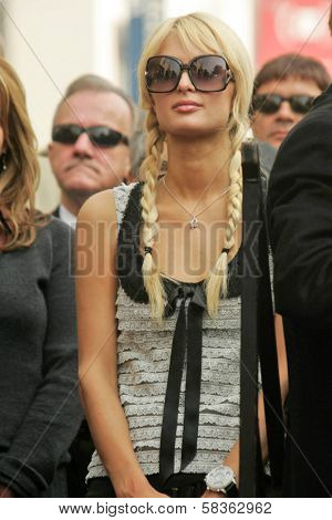 Paris Hilton at the Ceremony Honoring Los Angeles Lakers Owner Jerry Buss with the 2,323rd star on the Hollywood Walk of Fame. Hollywood Boulevard, Hollywood, CA. 10-30-06