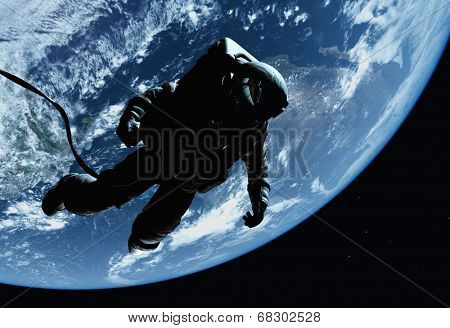 The astronaut on a background of a planet  
