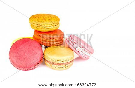 French colorful macarons on white background