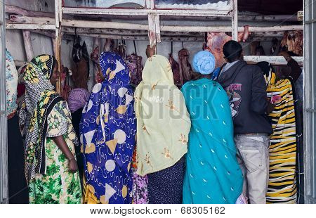 Harar. Ethiopia - December 23, 2013: Unidentified Traditionally Dressed Women In Butchery In Ancient