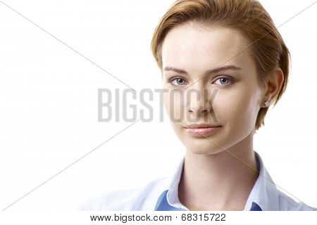 Closeup portrait of attractive young woman with pure face and blue eyes.