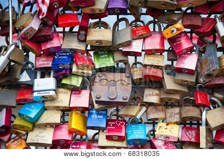COLOGNE, GERMANY - MAY 29, 2014, Thousands of love locks which sweethearts lock to the Hohenzollern Bridge to symbolize their love on May 29 in Koln, Germany 